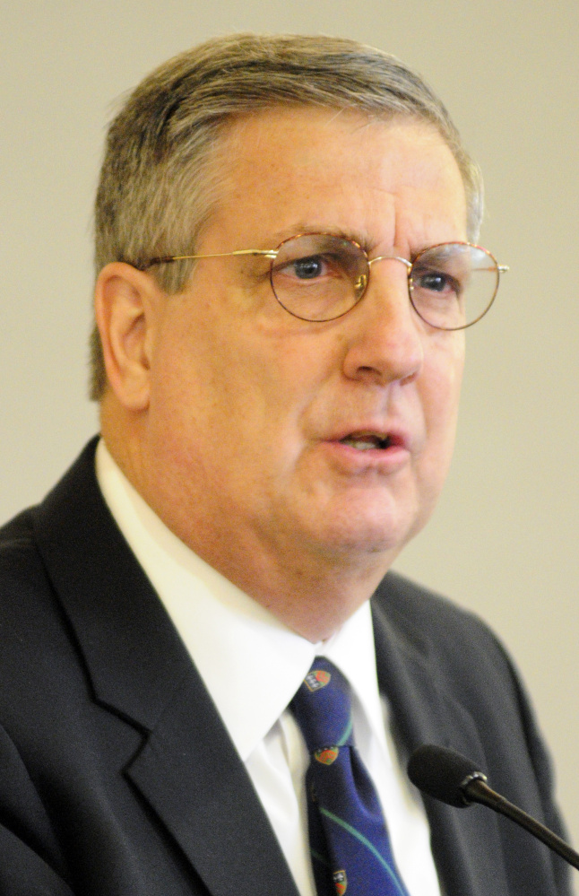 James Conneely speaks from the podium after being introduced as the new president of University of Maine at Augusta on Tuesday in Fireplace Lounge of Randall Hall on the University of Maine at Augusta campus.