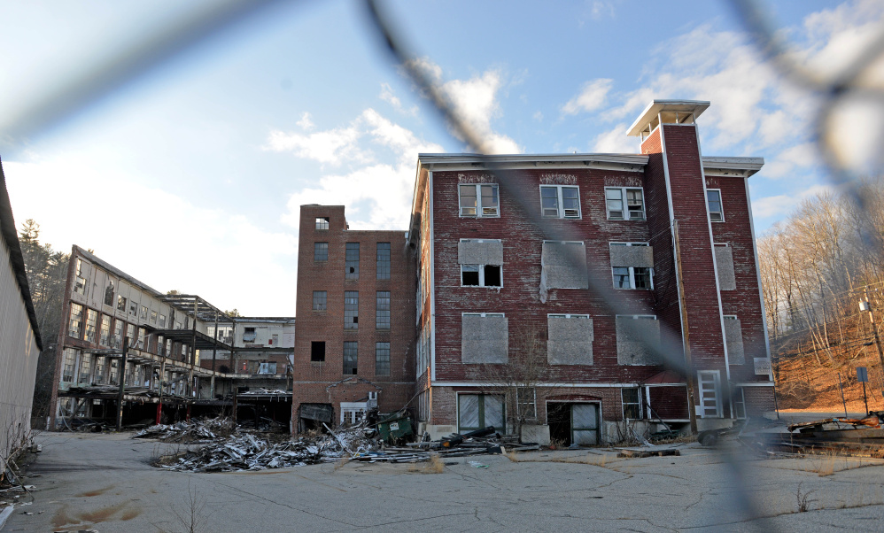 Wilton Town Manager Rhonda Irish is working on applications for grants to help pay for removal of environmental hazards at the Forster Mill in Wilton, shown last week. A second public hearing on the project is scheduled for Dec. 15.