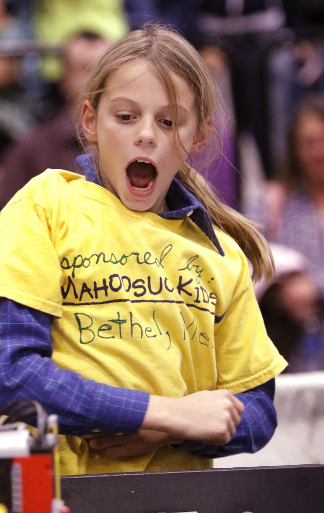 Eli Shiffrin, a fifth-grader at Crescent Park Elementary School in Bethel, reacts after his team’s robot successfully completes a mission Saturday during the Maine FIRST LEGO League State Championship at the Augusta Civic Center. Sixty teams from around the state competed in the championship.
