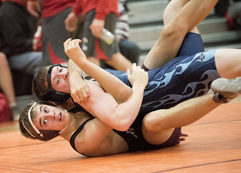 Nokomis’ David Wilson, bottom, takes on and defeats Portland’s Kyle Hansen during the 152-pound semifinals in the Tiger Invitational on Saturday in Gardiner.