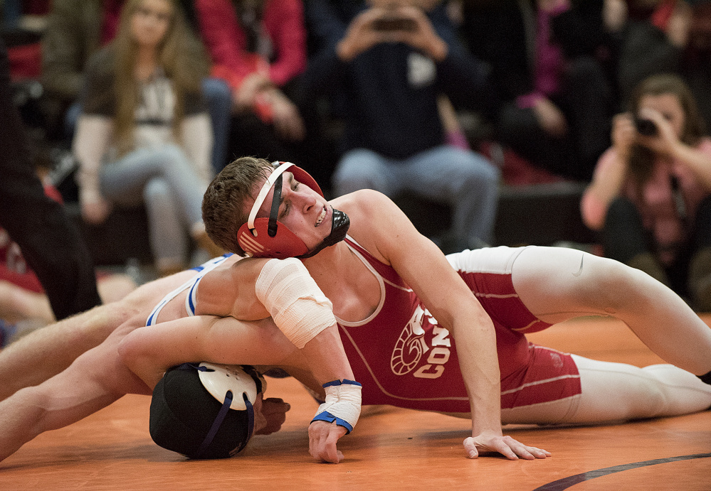 Cony’s Logan Benedict takes on and defeats Hunter Reed during the 160-pound semifinals in the Tiger Invitational on Saturday in Gardiner.