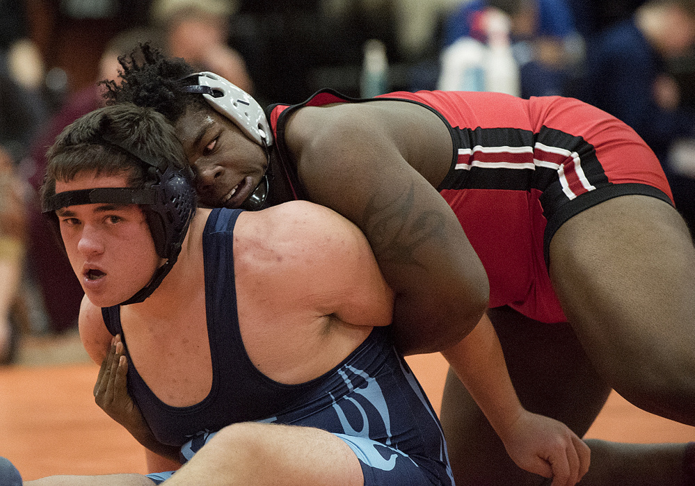 Cony’s Max Storey, right, defeats Westbrook’s Mikiel LePage during the 220-pound semifinals in the Tiger Invitational on Saturday in Gardiner.