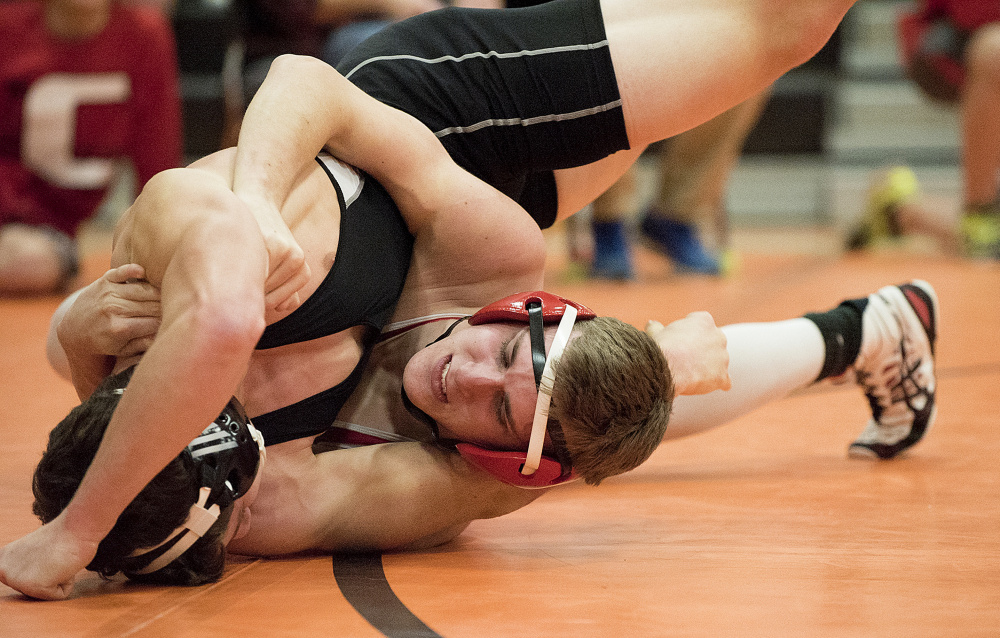 York’s Josh Smith, top, defeats Cony’s Logan Benedict, in the 160-pound finals in the Tiger Invitational on Saturday in Gardiner.