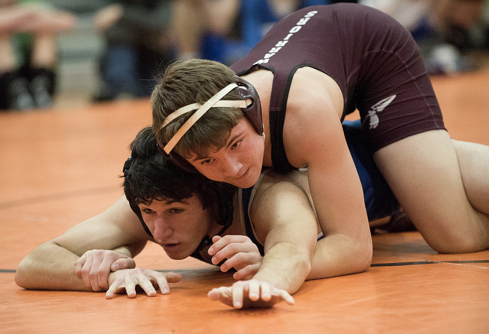 Nokomis’ Quinton Richards, top, defeats Erskine’s Gabe Solorzano during 138-pound semifinal action in the Tiger Invitational on Saturday in Gardiner.