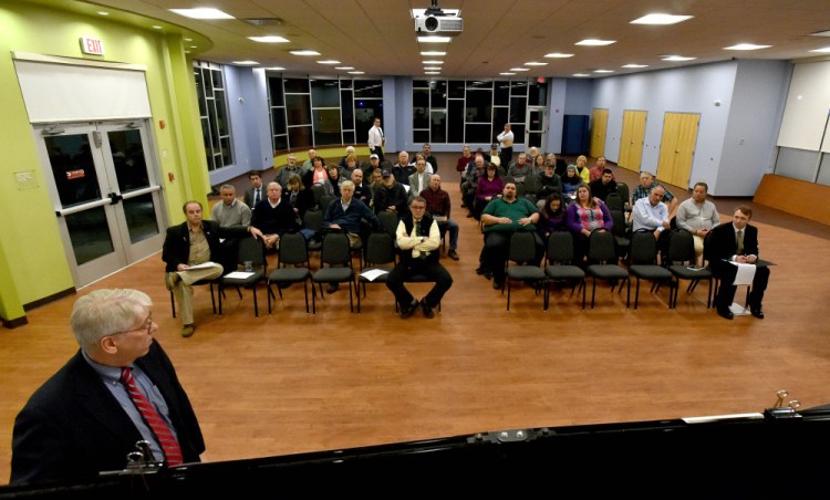 Area residents listen on Wednesday to a description of the proposed construction of a full-service interchange at Interstate 95 and Trafton Road in Waterville during a public meeting hosted by the Maine Department of Transportation at the Spann Commons Summit Room at Thomas College in Waterville.