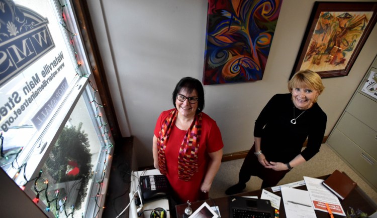 Jennifer Olsen, executive director of Main Street Waterville, left, and June L’Heureux, Main Street Waterville office manager, pose on Friday at the Main Street Waterville office. Olsen will be stepping down from her post Jan. 1 and L’Heureux will assume Olson’s duties until the board of directors can fill the position.