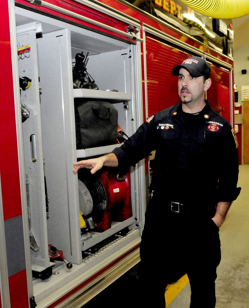 Skowhegan Fire Department Capt. Jason Frost speaks about the added compartment room for equipment in the departments’ new rescue/pumper truck, Engine 10, on Tuesday.
