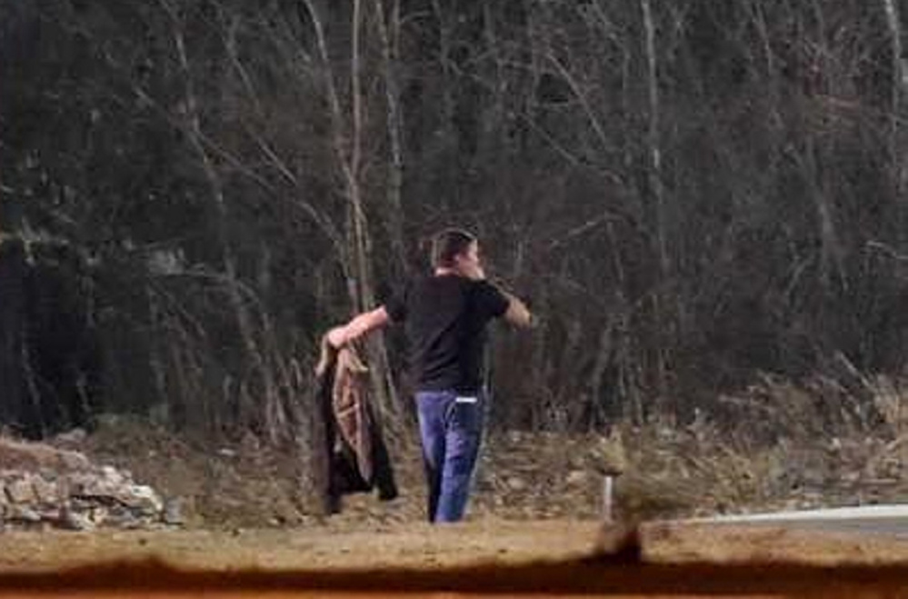 Gary Cross surrenders to police in the early morning hours of Dec. 8 after an eight-hour standoff with police in Waterville.