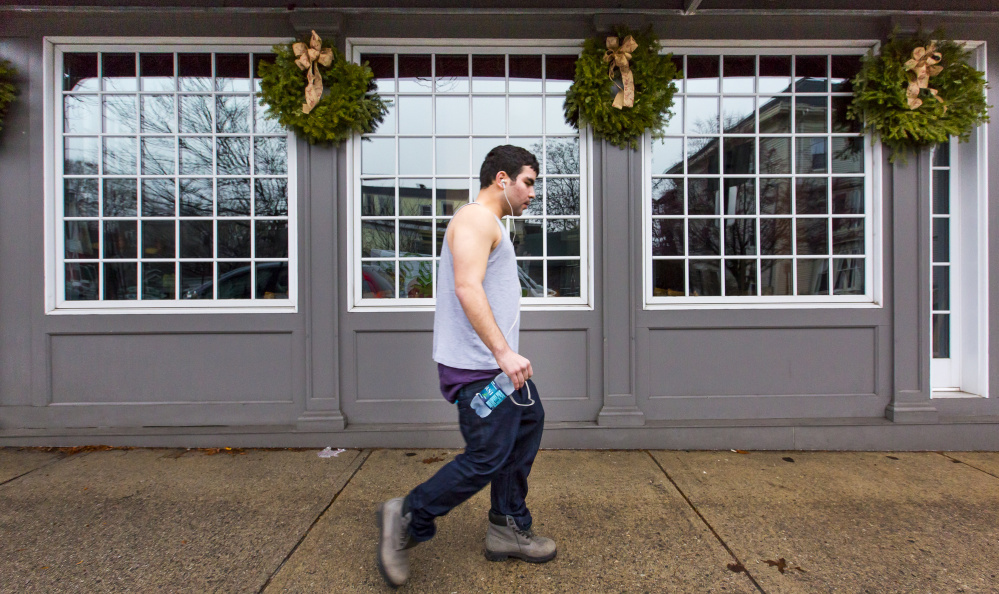 Ali Sayed of Portland walks on Munjoy Hill on Dec. 24, another balmy day in Portland.
Ben McCanna/Staff Photographer