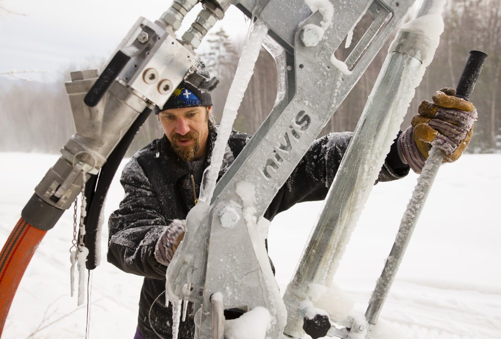 Mount Abram general manager Dave Scanlan adjusts one of the mountain’s new snowmaking guns. Carl D. Walsh/Staff Photographer
