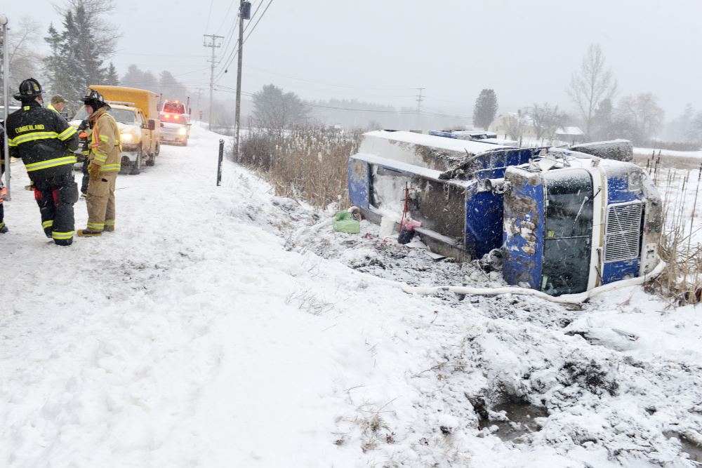 Cumberland firefighters respond to an accident on Greely Road in Cumberland after a fuel oil truck went off the road. The driver was uninjured but the truck contained about 1,700 gallons of oil that had to be pumped out before the vehicle could be pulled from the ditch.