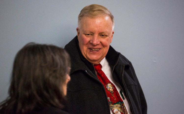 Lewiston Mayor Robert Macdonald speaks to voters at the James Longley Elementary School during Tuesday's runoff election. Macdonald was re-elected with 53 percent of the vote.