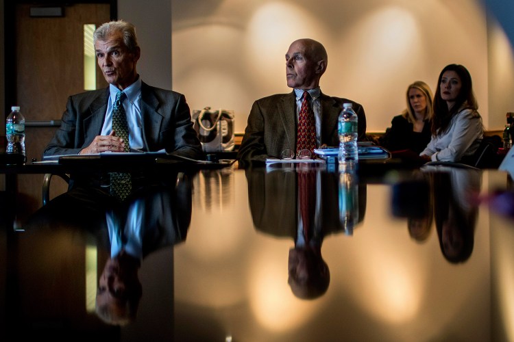 Michael Dubyak, left, former CEO of WEX, speaks at a news conference at the Gulf of Maine Research Institute in Portland on Tuesday to announce the creation of a nonpartisan think tank called FocusMaine, designed to address challenges in Maine's economic climate. At right is Charles Lawton, chief economist at Planning Decisions Inc.