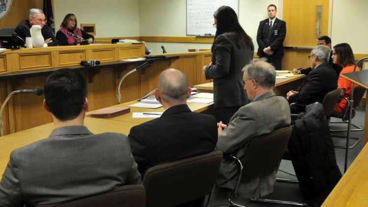 Justice Robert Mullen, left, listens from the Farmington District Court bench as Assistant Attorney General Deborah Cashman testifies during a guilty plea by defendant Dana Craney, far right, on Monday.