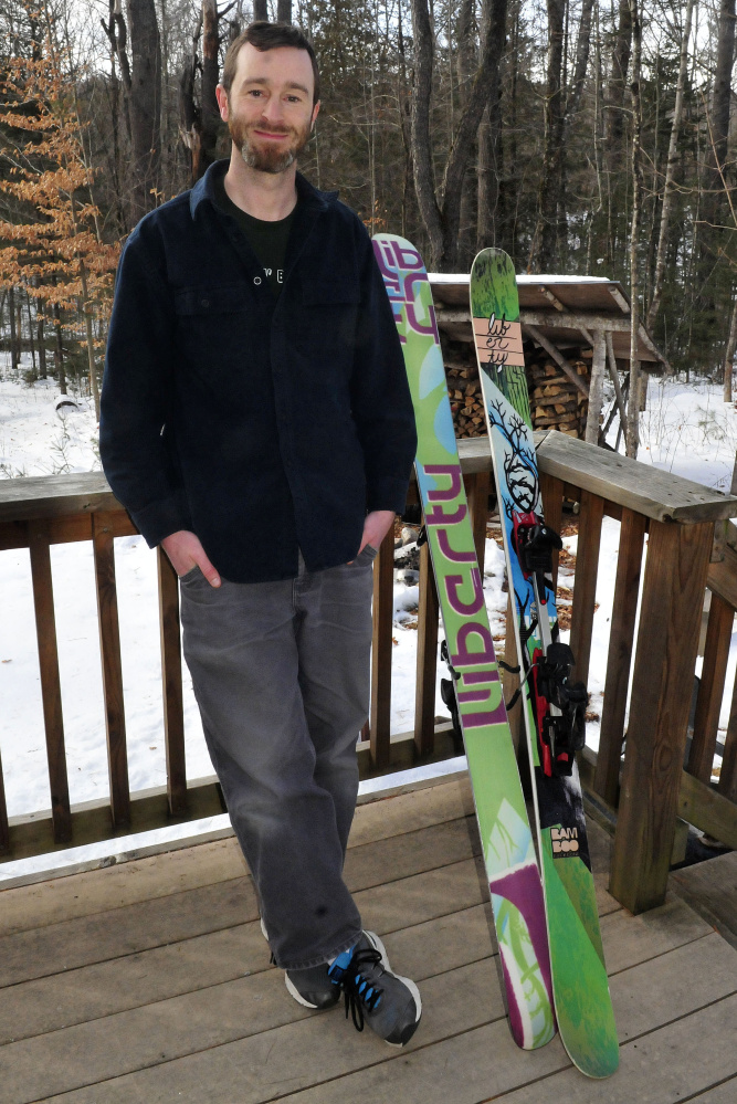 Avid skier Joel Osgood relaxes at his home in New Portland Monday.