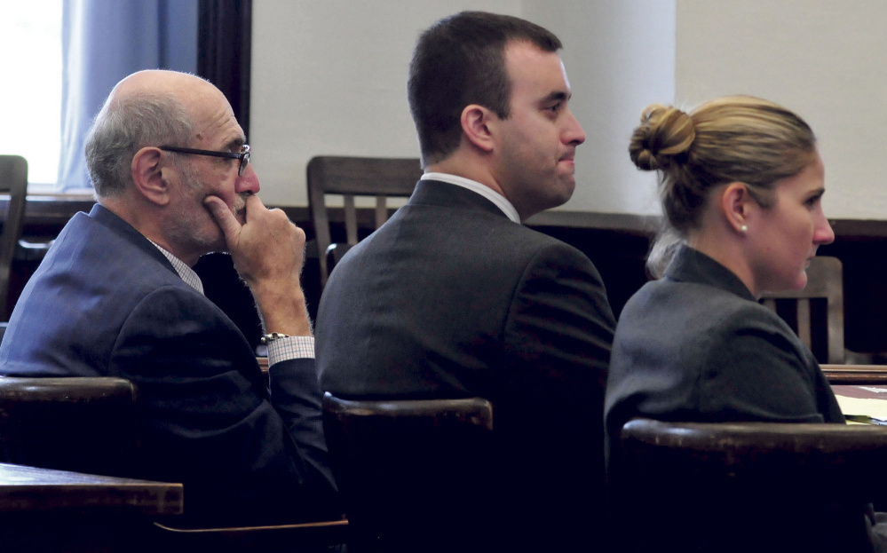 Andrew Maderios, center, and his attorneys Leonard Sharon and Caleigh Milton listen to the victim make statements prior to Maderios being sentenced to three years in prison for convictions of domestic violence in Somerset Superior Court in Skowhegan on Sept. 28, 2015.