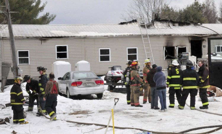 Firefighters from several departments battled a fire that destroyed a mobile home on South Main Street in Athens Tuesday morning,