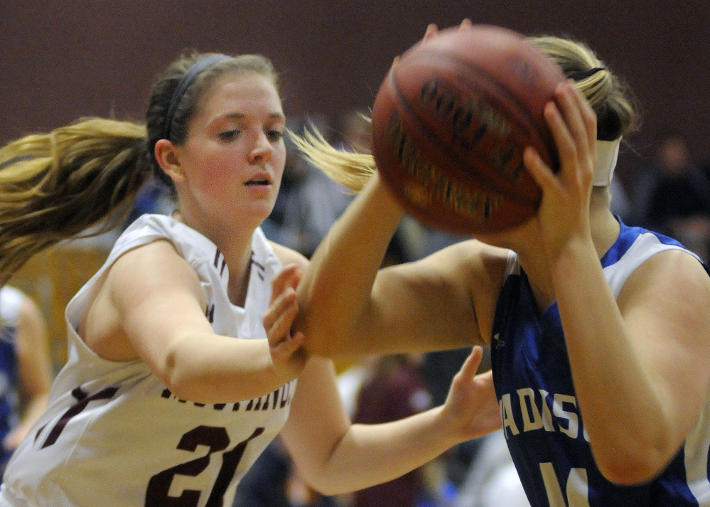 Monmouth’s Haley West blocks Madison’s Erin Whalen during a Mountain Valley Conference game earlier this season. West and the Mustangs are second in Cass C South Heal points.