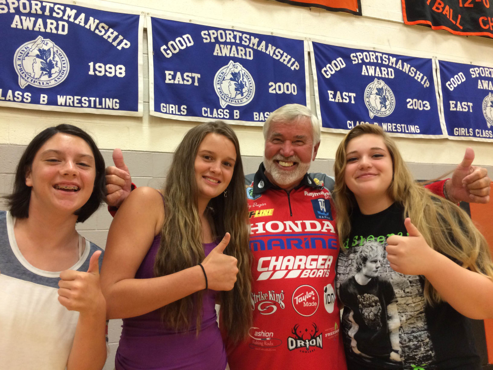 Ray Brazier, one of the hosts of “Fishing University,” visits with area students at Winslow High School in September while the show was filming on China Lake and in Waterville. Brazier and co-host Charlie Ingram met with students from the high school and Mid-Maine Technical Center at the school. The names of the students pictured were not available.