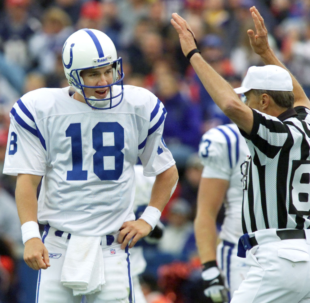 Yes, that’s a young Peyton Manning looking on in disbelief as referee Bernie Kukar signals a New England touchdown on an interception by Patriots cornerback Ty Law on Sept. 30, 2001. Law finished with nine career interceptions against Manning. Today’s honorary captain for New England against Manning and Denver? Yes, it’s Ty Law.