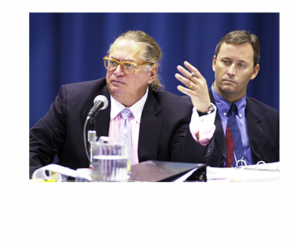 Shawn Scott, right, listens as one of his attorneys, Martin Gersten, questions a witness at a licensing hearing in 2003. Scott is the only person who meets the criteria for a proposed referendum question for a gambling establishment in York County.