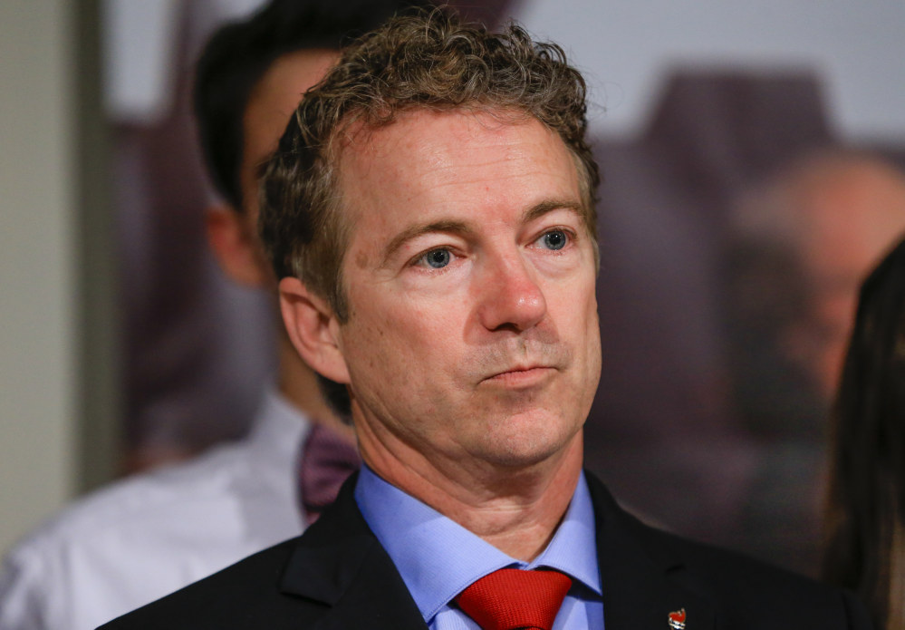 The Associated Press Republican presidential candidate, Sen. Rand Paul, R-Ky, waits to speak to supporters during a caucus night rally at the Scottish Rite Consistory in Des Moines, Iowa, Monday.