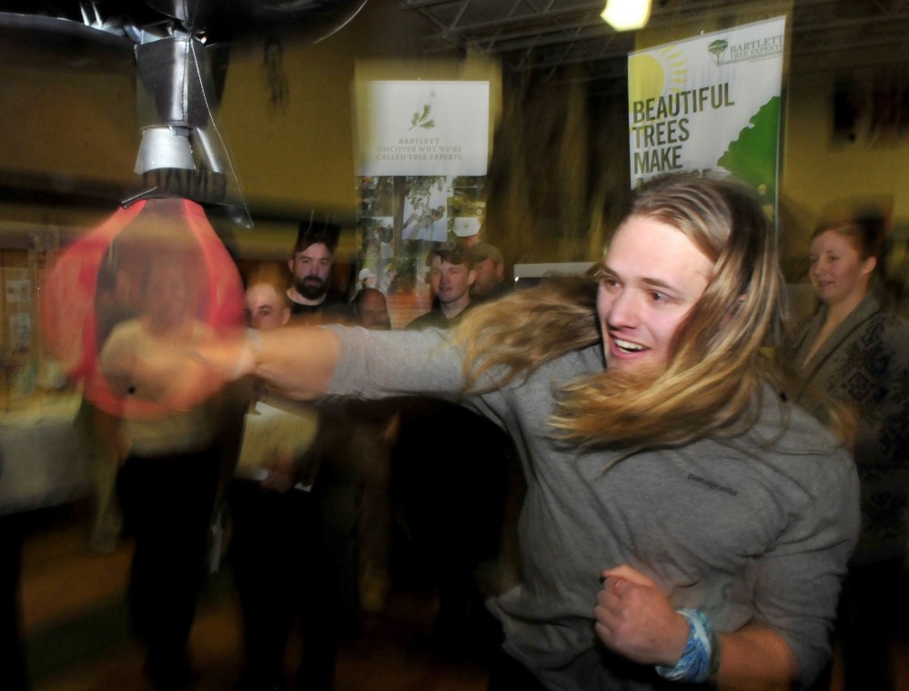 Staff photo by David Leaming
Unity College student Sunshine Gardner tries to beat the top score in a popular punching bag event sponsored by the Maine Army National Guard during a career fair at the college on Tuesday. Gardner is majoring in adventure-based environmental education.