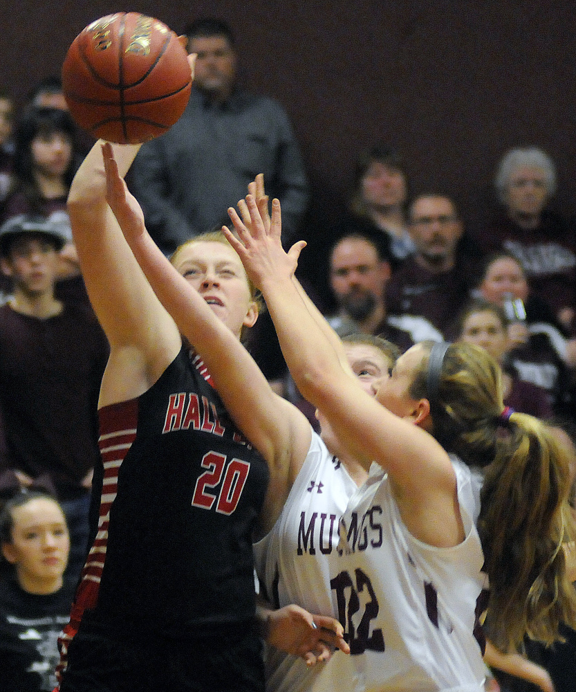 Monmouth Academy’s Sidney Wilson, right, and Abbey Allen block a shot from Hall-Dale’s Sabrina Freeman during a Class C South prelim game Tuesday in Monmouth.