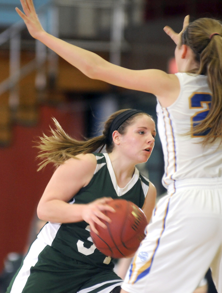 Carrabec senior guard Bailey Atwood, left, looks for an opening around Boothbay’s Hannah Morley during a Class C South quarterfinal Monday against at the Augusta Civic Center. Boothbay won, 32-17.