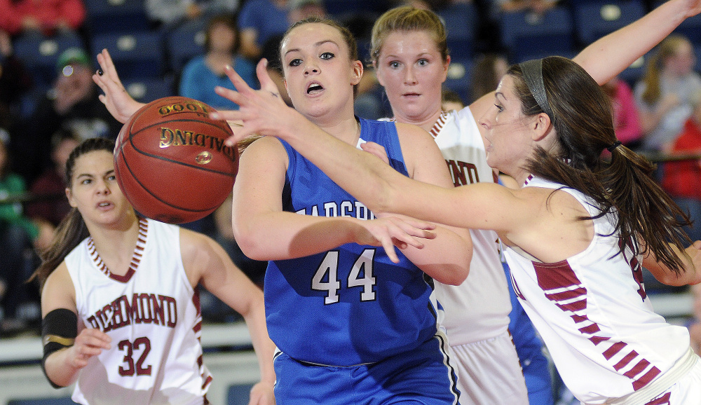 Richmond High School’s Meranda Martin, right, blocks a pass while teammates Kelsea Anair, center, and Mackenzie Abbott guard Searsport’s Anna Bucklin during a Class C South quarterfinal on Tuesday at the Augusta Civic Center.