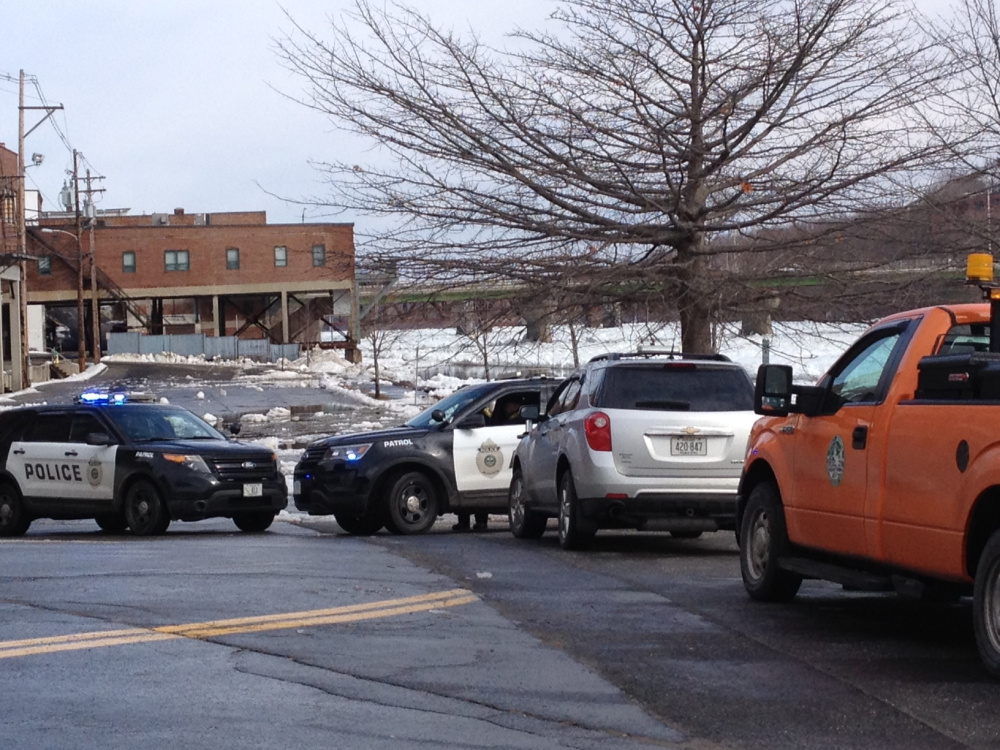 An Augusta police cruiser blocks off Front Street in Augusta because of Kennebec River flooding.