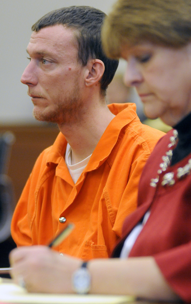 Mark Halle, of Waterville, listens during his bail hearing with his attorney, Pamela Ames, on Wednesday in the Capital Judicial Center in Augusta.