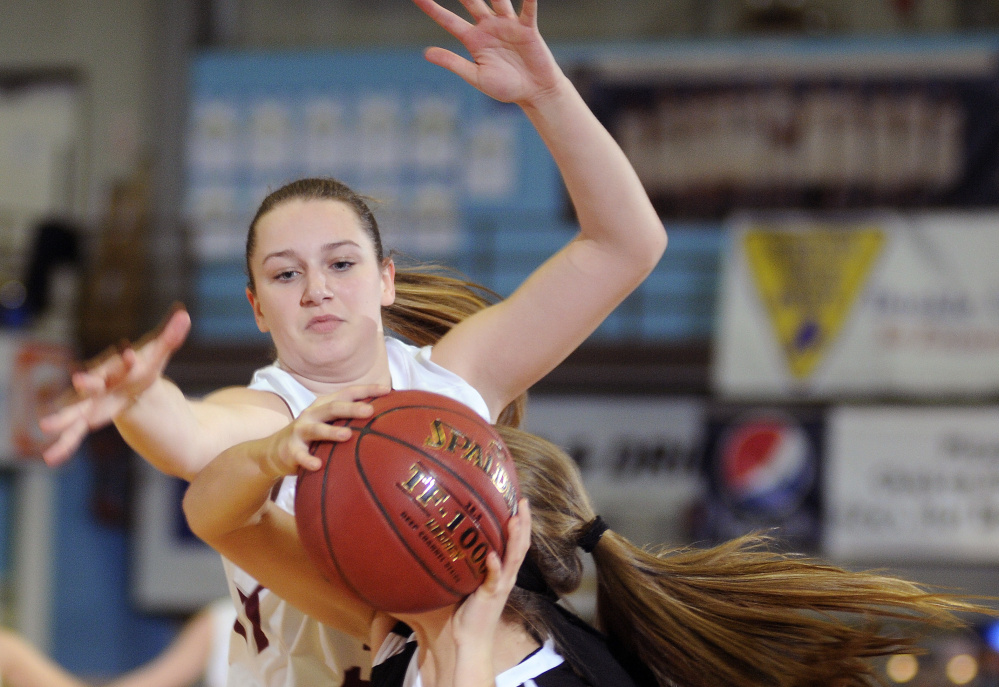 Monmouth’s Maddie Amero, back, defends St. Dominic’s Madison Leslie during a Class C South quarterfinal Monday at the Augusta Civic Center.