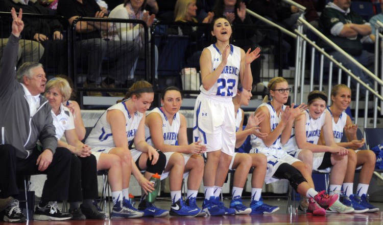 The Lawrence High School bench celebrates their victory over Hampden Academy during a Class A North semifinal Wednesday night at the Augusta Civic Center.