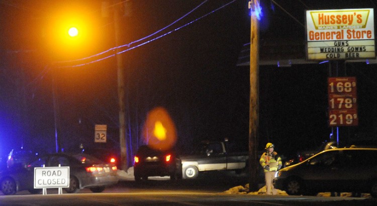 Route 32 in Windsor was closed Wednesday while police evacuated an apartment building across the road following a report of a despondent man inside with a gun.