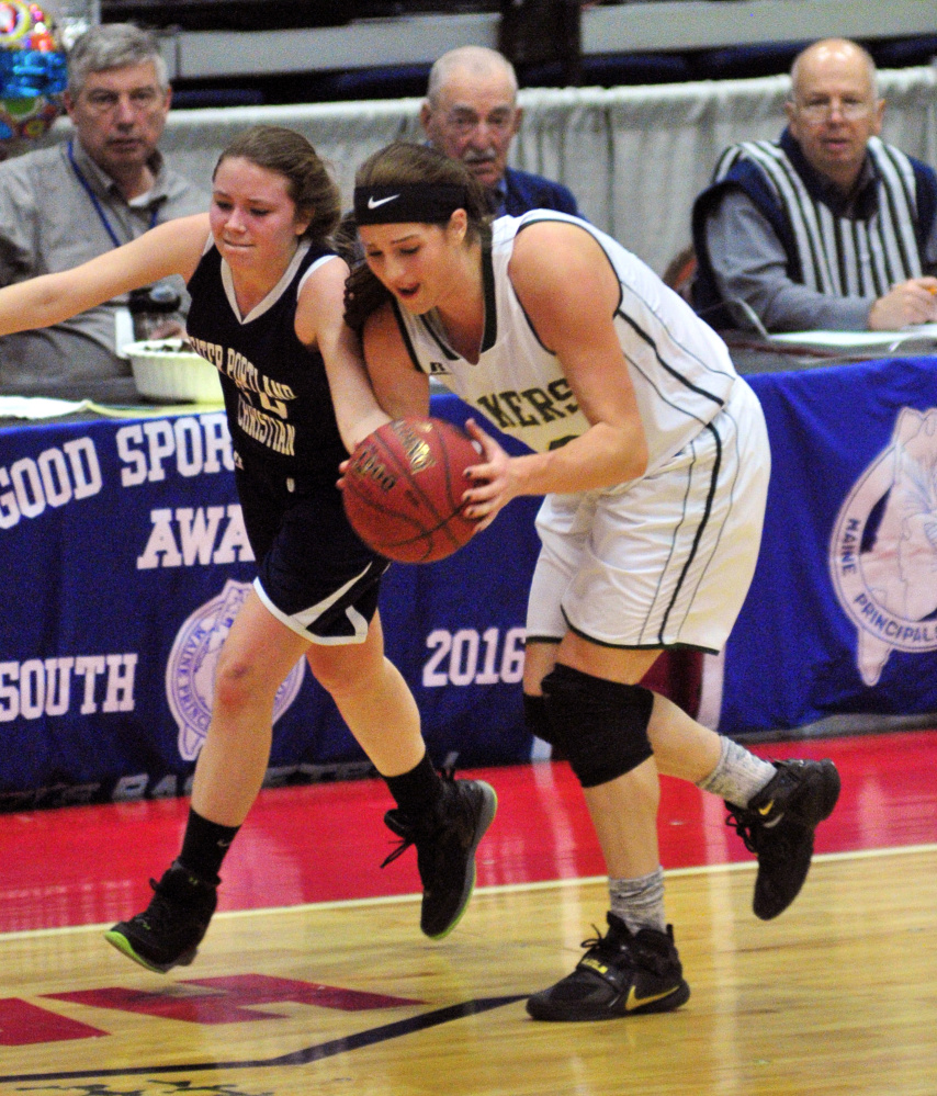 Greater Portland Christian guard Angela Jones and Rangeley’s Blayke Morin, right, battle for the ball during a Class D South quarterfinal game Wednesday at the Augusta Civic Center.