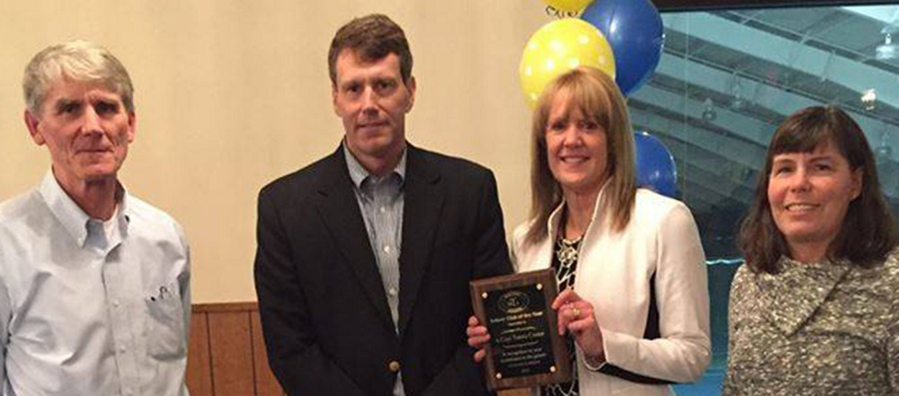 Don Gasink, president of the Kennebec Valley Tennis Association; Brian Major, president of the Maine Tennis Association; Deidre Hutchins, A-Copi Tennis & Sports Center’s facility manager; and Hilary Holm, KVTA treasurer, pose recently with the Augusta facility’s 2015 Indoor Club of the Year award.