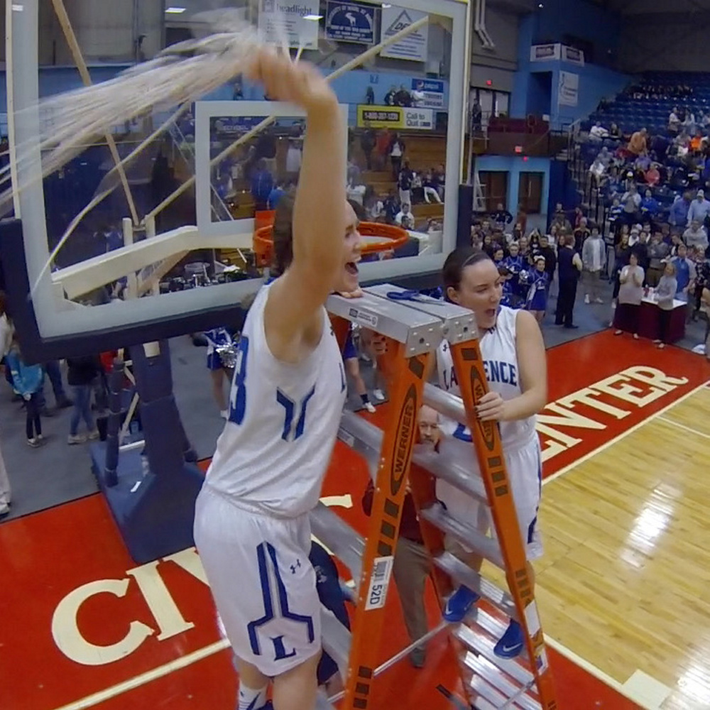 Nia Irving, left, and Emily Tozier celebrate after Lawrence sank Messalonskee 59-44 in the Class A North championship last Friday in the Augusta Civic Center. Irving was named a finalist for Miss Maine Basketball on Tuesday.