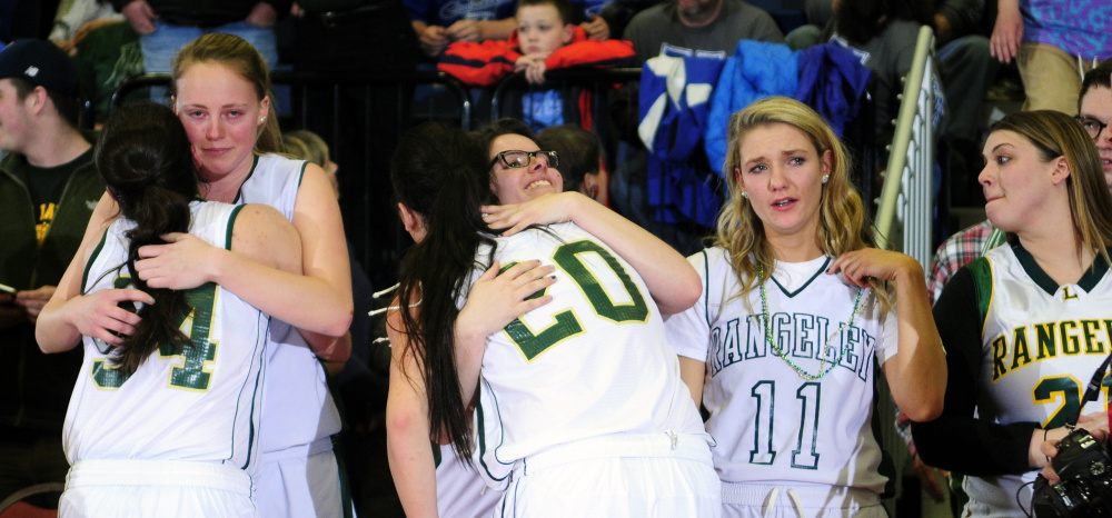 Rangeley players — past and present — celebrate after the Lakers won the Class D state title Saturday afternoon at the Augusta Civic Center.