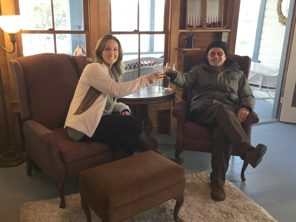 Page Daggett, the daughter of Tom and Beverly Daggett of Augusta, shares a glass of wine with her father at the end of the show.