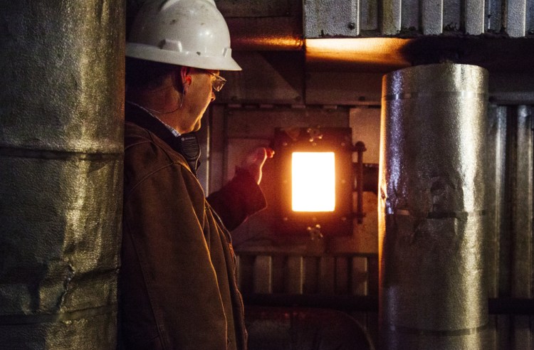 David Ettinger of ReEnergy inside its Livermore Falls biomass plant.