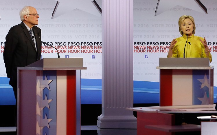 Hillary Clinton makes a point as Bernie Sanders listens during Thursday night's Democratic presidential debate at the University of Wisconsin-Milwaukee.
The Associated Press