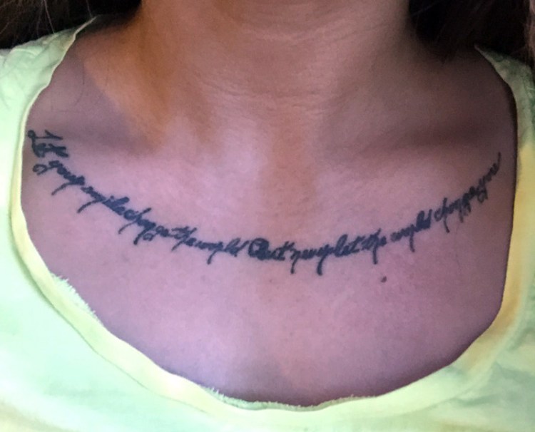 Kate Pimental was told by a local recruiter that she would not be allowed to enlist because of the tattoo, which runs across her neckline and reads, “Let your smile change the world but never let the world change you.”