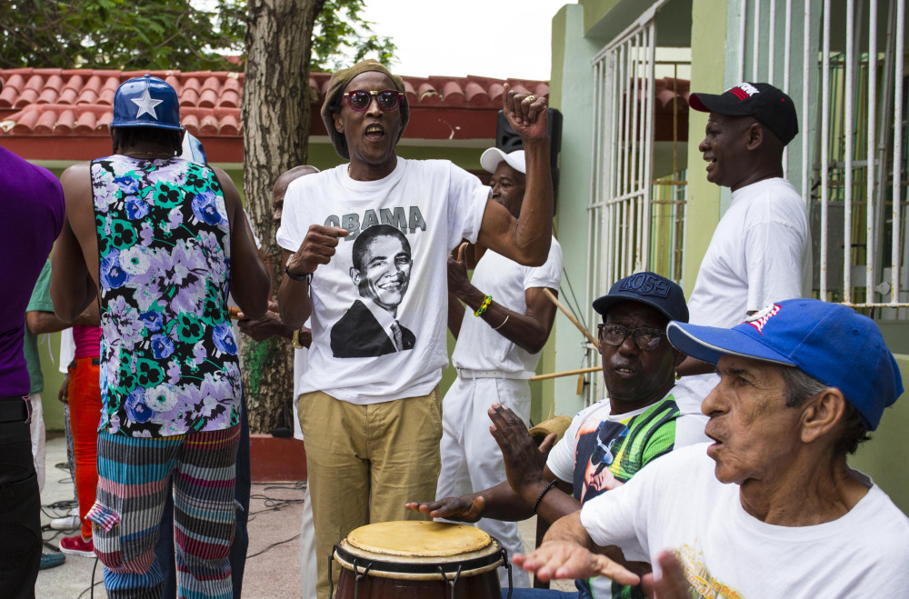 A musician performs wearing a T-shirt designed with an image of President Barack Obama at a weekly rumba dance gathering in Havana, Cuba, Saturday.