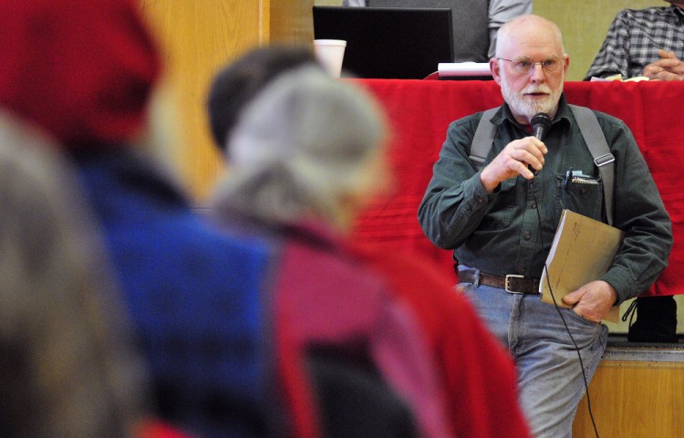 Erik Ekholm speaks about a proposal to put solar panels on the fire station during the annual Whitefield Town Meeting on Saturday in the Whitefield Elementary School.