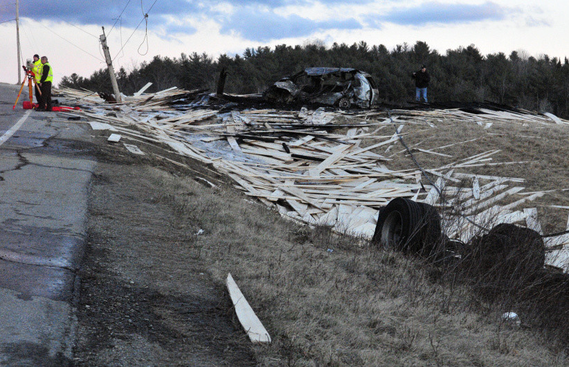 Police and firefighters work at the scene of multi-vehicle accident Friday on Route 17 near the Fitch Road intersection in Washington.