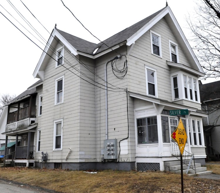 A fire that caused damage to this apartment building at 58 Silver St.t in Waterville late on Sunday was possibly set deliberately, police and fire officials said Monday. One five minutes earlier in a nearby pickup truck is also under investigation.