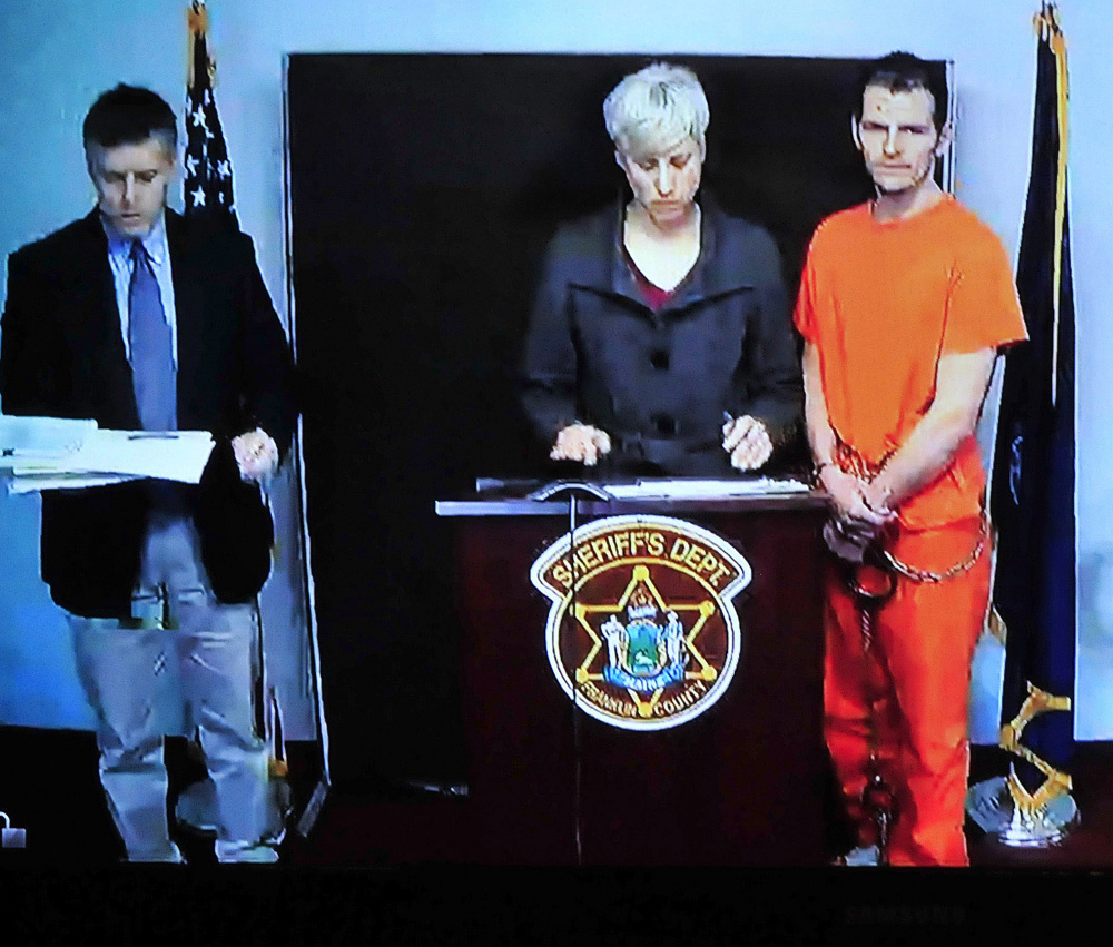 Defendant Derek Cook listens as his attorney Luanne Calcagri and Franklin County Assistant District Attorney Joshua Robbins discuss bail conditions during a video hearing at Rumford District Court on March 2.