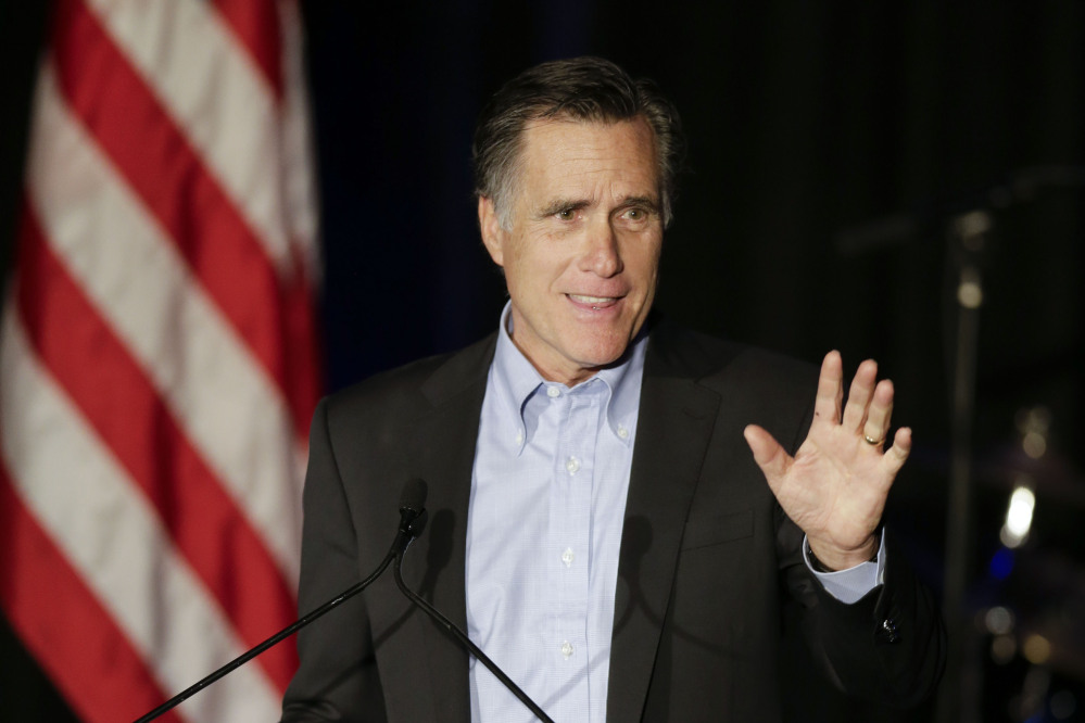 FILE - In this Jan. 16, 2015, file photo, Mitt Romney, the former Republican presidential nominee, speaks during the Republican National Committee’s winter meeting aboard the USS Midway Museum in San Diego. Romney charged into the increasingly divisive 2016 GOP White House sweepstakes Thursday, March 3, 2016, with a harsh takedown of front-runner Donald Trump.