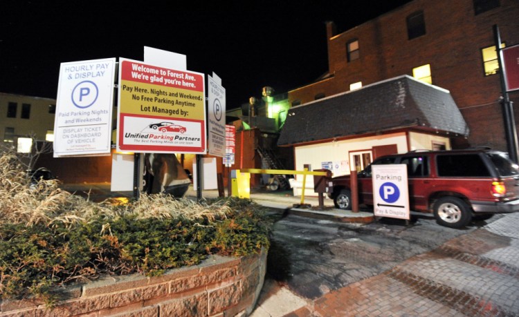 Unified Parking Partners runs about 40 lots and garages in Portland, including this lot on Forest Avenue. It charges by the hour, replacing flat fees that existed for years.   Shawn Patrick Ouellette/Staff Photographer